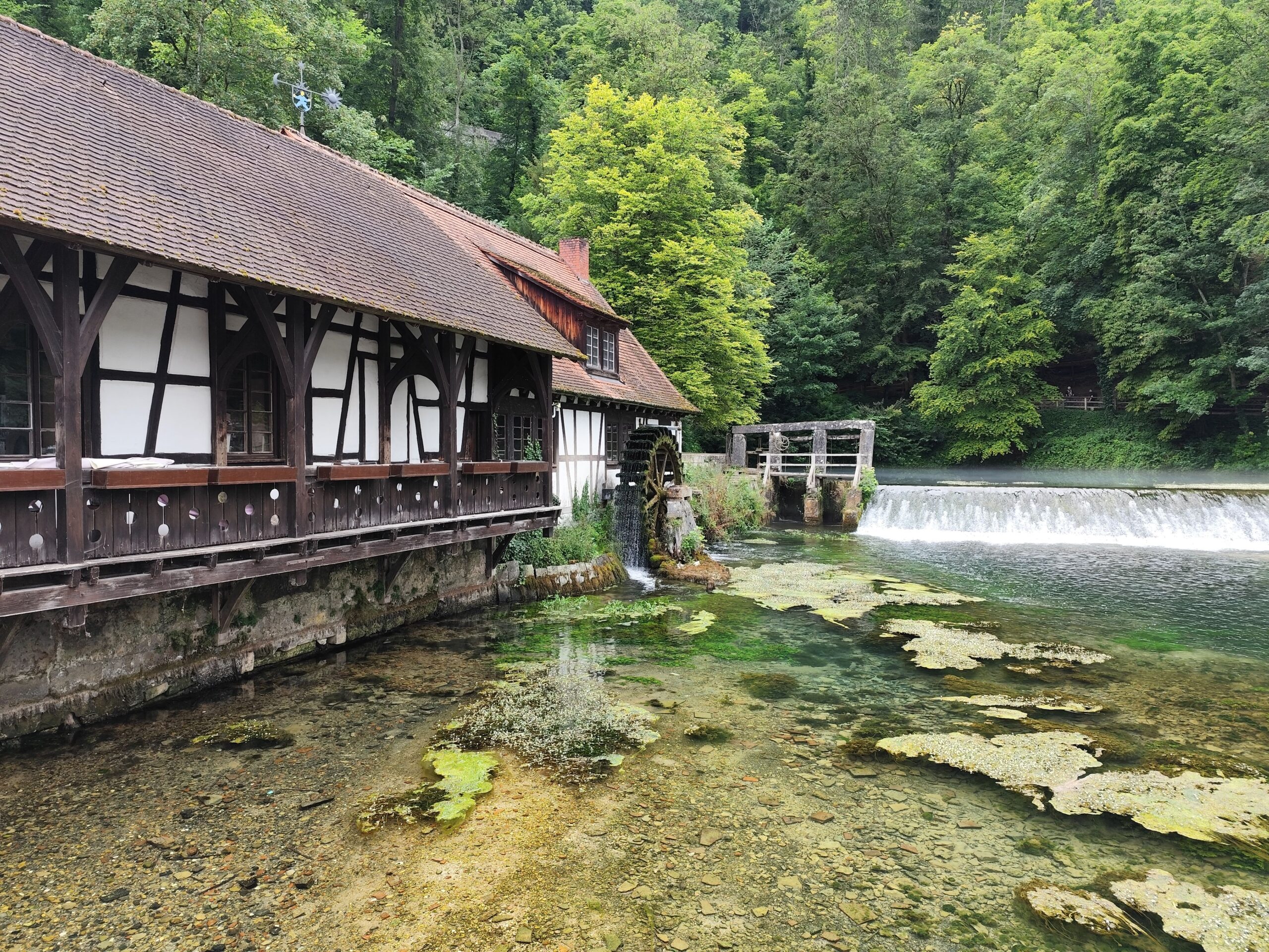 Traditional mill house by the Blautopf Spring near the Danube's source region in Germany